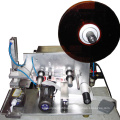 Semi-auto tamp labeler for bottle